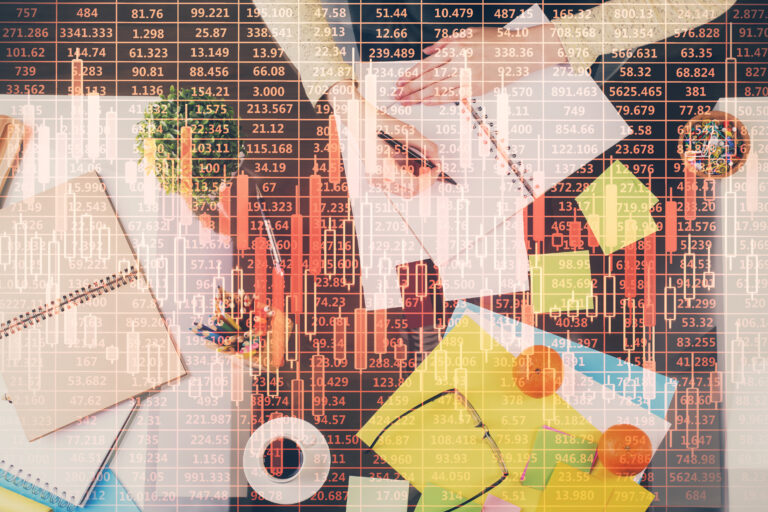 Hand taking notes in notepad. Forex chart holograms in front. Concept of research